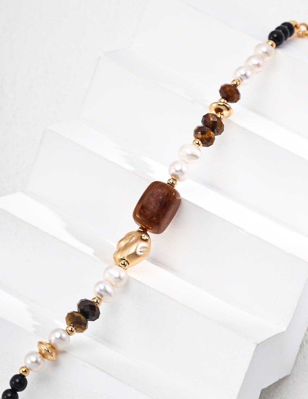 Bracelet with pearl, tiger eye, and agate beads in a gold-plated silver by ronny