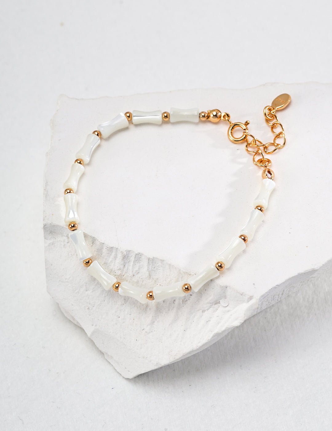 Bamboo bracelet crafted with conch shell and gold-plated silver by ronny