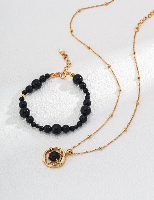 Gold-plated necklace with a black onyx pendant  and bracelet by ronny